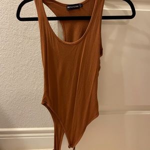 Burnt orange body suit